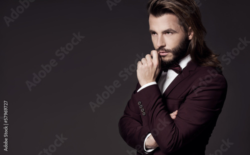 Photo: Portrait of handsome stylish man in elegant suit Portrait of handsome stylish man in elegant suit