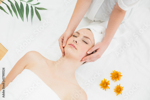 Photo: Hands massaging a beautiful woman's face Hands massaging a beautiful woman's face