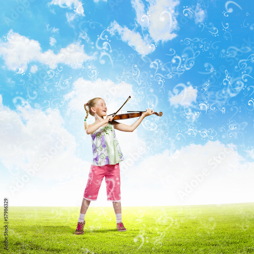 Photo: Girl playing violin Girl playing violin