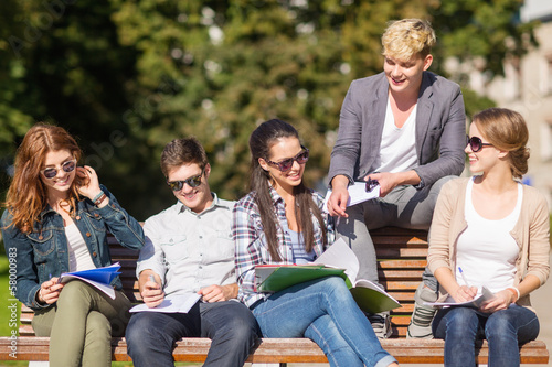 Photo: group of students or teenagers hanging out group of students or teenagers hanging out