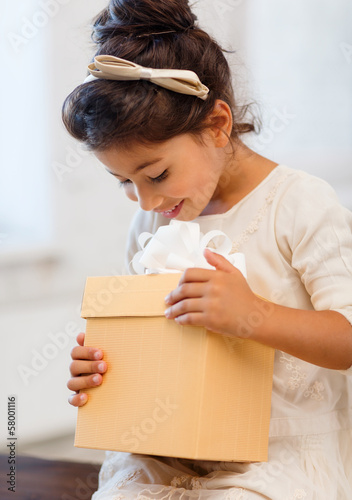Photo: happy child girl with gift box happy child girl with gift box
