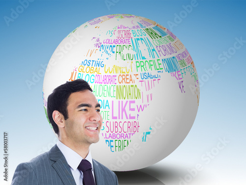 Photo: Composite image of smiling businessman standing Composite image of smiling businessman standing