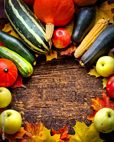 Photo: Autumn harvest - Vegetable,fruits on wooden background Autumn harvest - Vegetable,fruits on wooden background