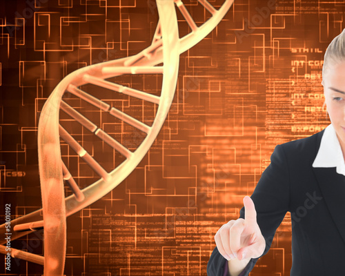 Photo: Composite image of businesswoman pointing somewhere Composite image of businesswoman pointing somewhere