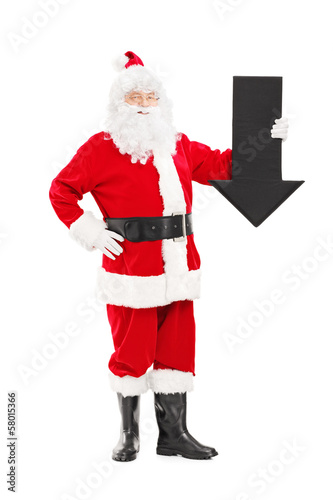 Photo: Smiling Santa Claus holding an arrow pointing down Smiling Santa Claus holding an arrow pointing down