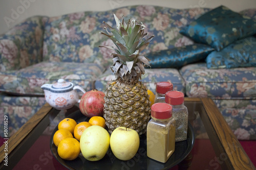 Photo: Fresh fruits, spices and teapot on the table ininterior. Fresh fruits, spices and teapot on the table ininterior.