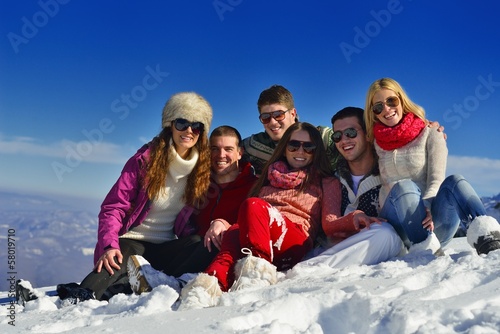 Photo: friends have fun at winter on fresh snow friends have fun at winter on fresh snow