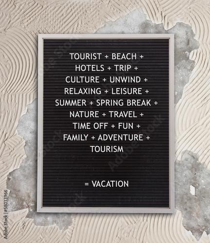 Photo: Vacation concept in plastic letters on very old menu board Vacation concept in plastic letters on very old menu board