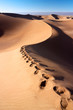 Human footprints on dunes of Erg Chigaga desert Human footprints on dunes of Erg Chigaga desert