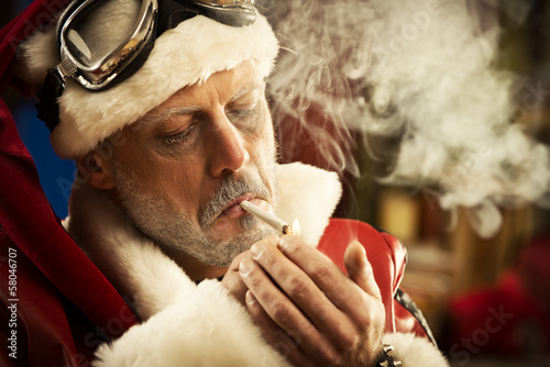 Photo: Bad Santa smoking a joint Bad Santa smoking a joint