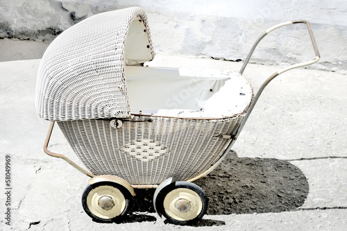 Photo: Picture shows antique, wicker stroller for children. Picture shows antique, wicker stroller for children.