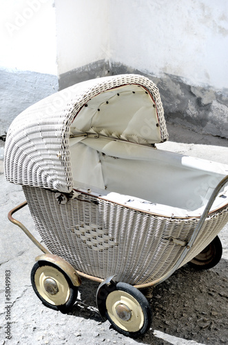 Photo: The picture shows antique, wicker stroller. The picture shows antique, wicker stroller.