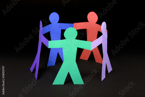 Photo: Circle of colorful paper people on black background Circle of colorful paper people on black background