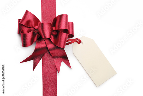 Photo: Red ribbon bow with blank gift tag Red ribbon bow with blank gift tag
