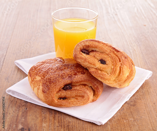 Photo: croissant and orange juice croissant and orange juice