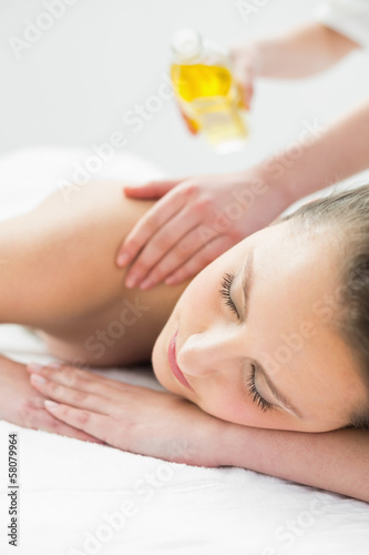 Photo: Beautiful woman enjoying oil massage Beautiful woman enjoying oil massage
