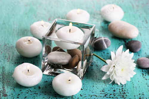 Photo: Decorative vase with candles, water and stones Decorative vase with candles, water and stones