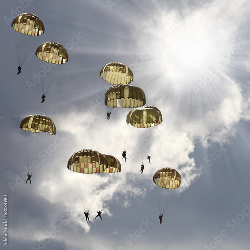Photo: The skydivers on stormy sky. The skydivers on stormy sky.