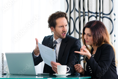 Photo: Boss and assistant or in hotel working together Boss and assistant or in hotel working together