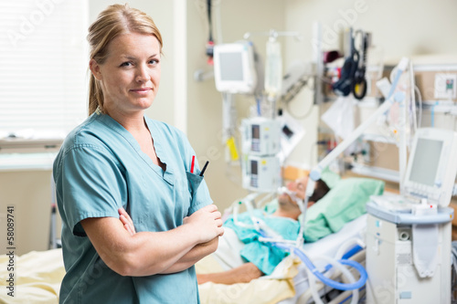 Photo: Confident Nurse With Patient Resting In Hospital Confident Nurse With Patient Resting In Hospital