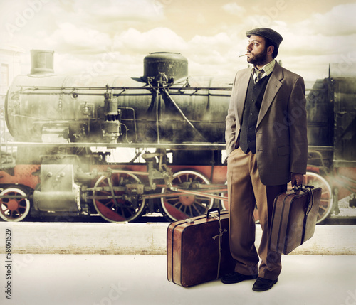 Photo: Emigrant to the train station with cardboard suitcases Emigrant to the train station with cardboard suitcases