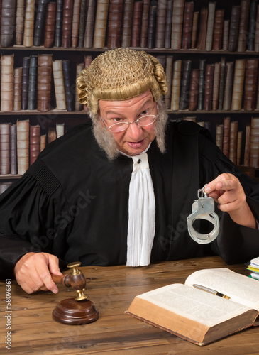 Photo: Judge showing handcuffs Judge showing handcuffs