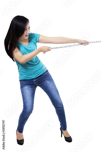 Photo: Beautiful woman pulling the chain Beautiful woman pulling the chain