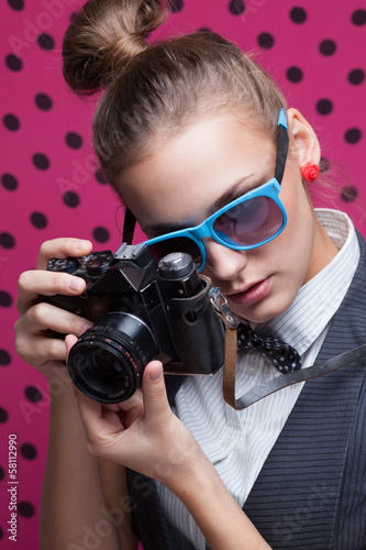 Photo: Hipster girl taking a photo Hipster girl taking a photo
