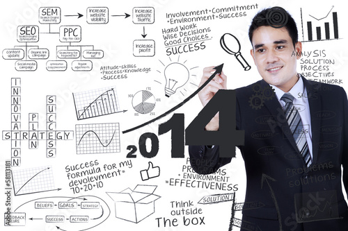 Photo: Businessman writing a business concept Businessman writing a business concept