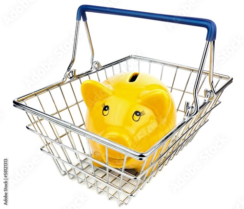 Photo: A yellow smiling piggy bank in a shopping basket A yellow smiling piggy bank in a shopping basket