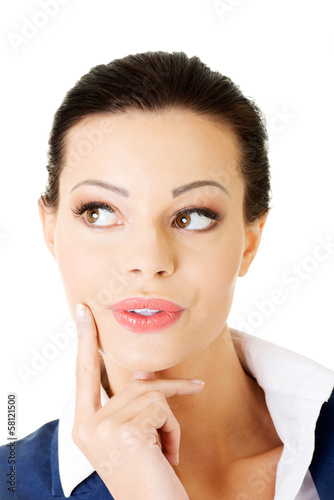 Photo: Young attractive businesswoman. Face expression. Thinking. Young attractive businesswoman. Face expression. Thinking.