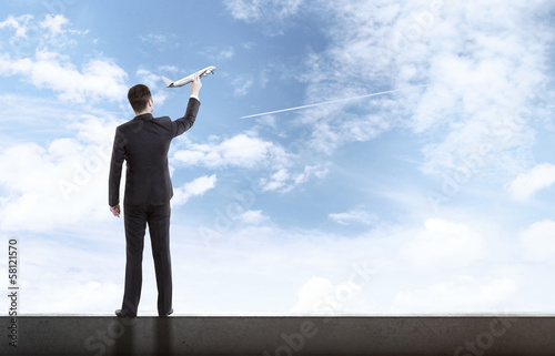 Photo: man holding airplane man holding airplane