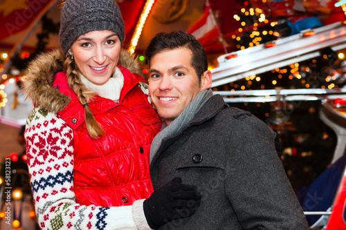 Photo: Couple during the Christmas market or advent season Couple during the Christmas market or advent season