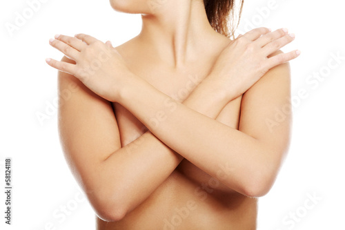 Photo: Sexy beautiful naked woman covering her breasts. Sexy beautiful naked woman covering her breasts.