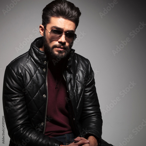 Photo: man with long beard is sitting and looking sad man with long beard is sitting and looking sad