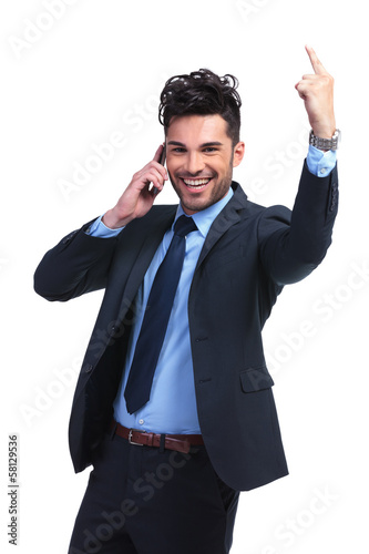 Photo: business man talking at the phone and winning business man talking at the phone and winning