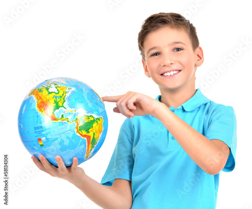 Photo: Smiling boy in casual holding globe in hands Smiling boy in casual holding globe in hands