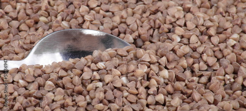 Photo: buckwheat background and teaspoon buckwheat background and teaspoon