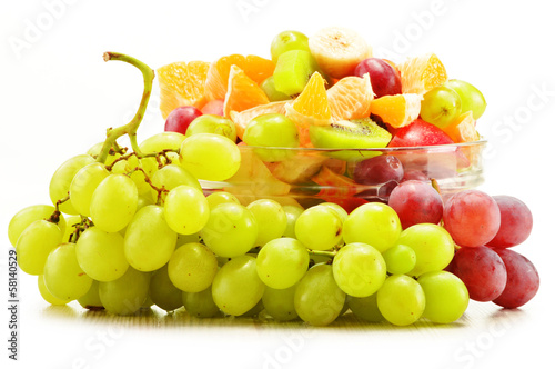 Photo: Fruit salad bowl isolated on white Fruit salad bowl isolated on white