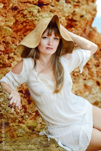 Photo: beautiful woman wearing straw hat beautiful woman wearing straw hat