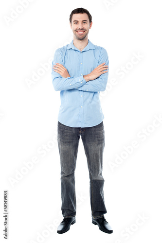 Photo: Confident young casual guy, studio shot. Confident young casual guy, studio shot.