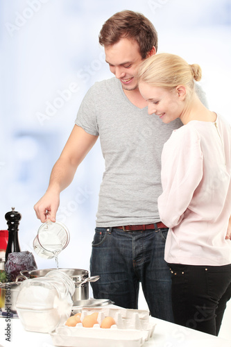 Photo: Happy couple in their kitchen Happy couple in their kitchen