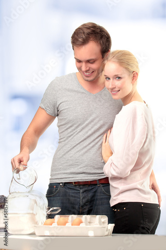 Photo: Happy couple in their kitchen Happy couple in their kitchen