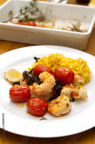 Photo: Prawns with risotto rice and tomatoes Prawns with risotto rice and tomatoes