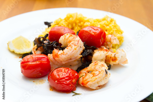 Photo: Prawns with risotto rice and tomatoes Prawns with risotto rice and tomatoes