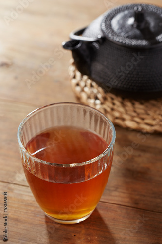 Photo: Brown tea on glass cup Brown tea on glass cup