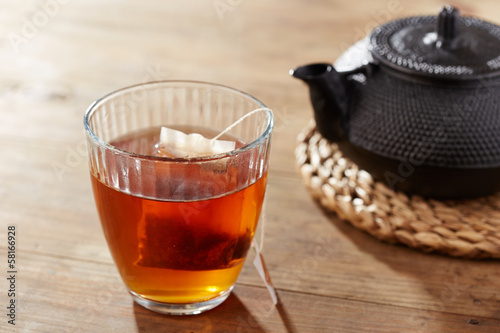 Photo: Brown tea on glass cup Brown tea on glass cup