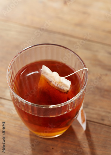 Photo: Brown tea on glass cup Brown tea on glass cup