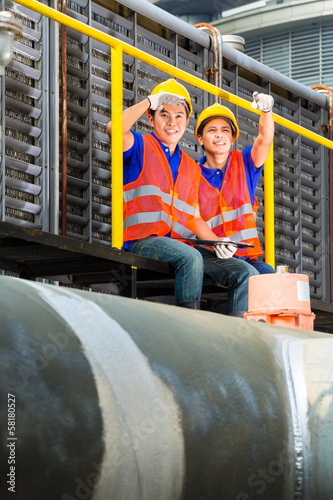 Photo: Asian technicians or workers on construction site Asian technicians or workers on construction site