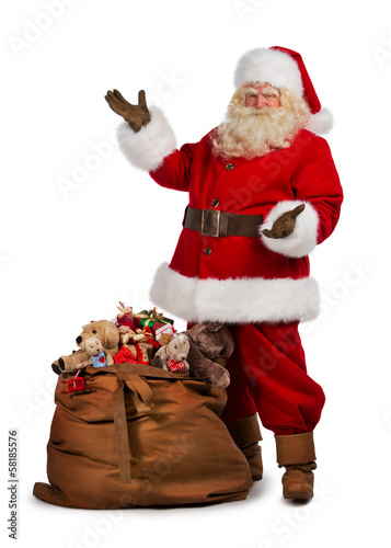 Photo: Santa Claus posing near a bag full of gifts Santa Claus posing near a bag full of gifts